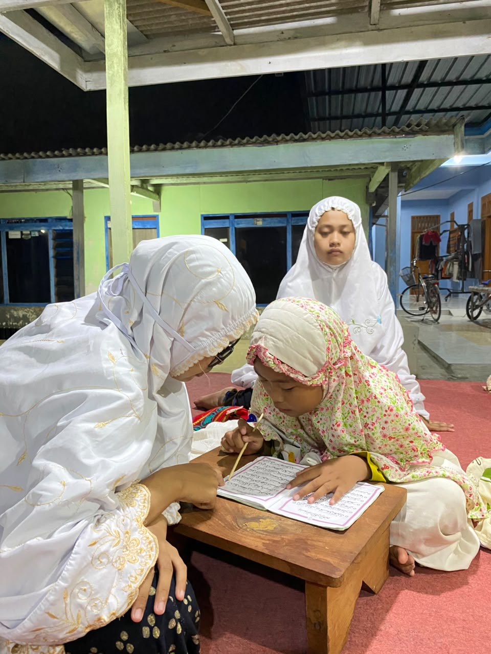 Mengajar mengaji di TPQ kelompok mengaji kedua yang ada di sekitar desa Tanjung